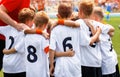 Young Boys In Football Team. Group Of Children In Soccer Team. School Football CoachÃ¢â¬â¢s Pregame Speech